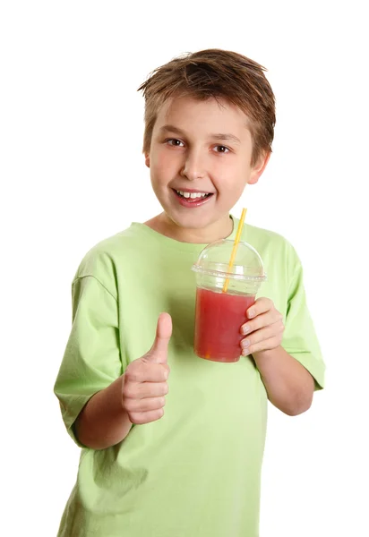 Rapaz saudável beber suco polegares para cima — Fotografia de Stock