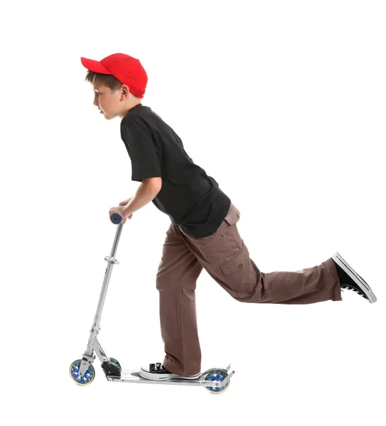 Niño montando un juguete scooter — Foto de Stock