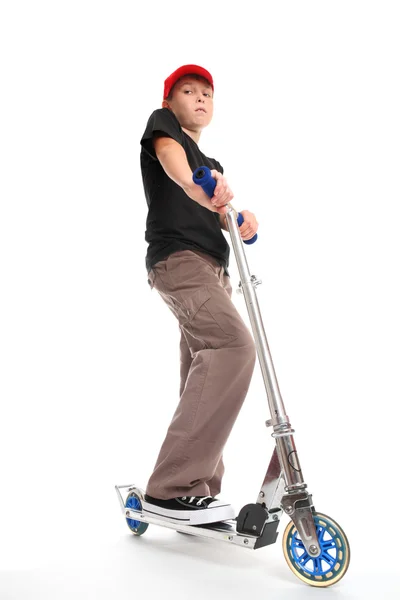 Boy standing on a scooter — Stock Photo, Image