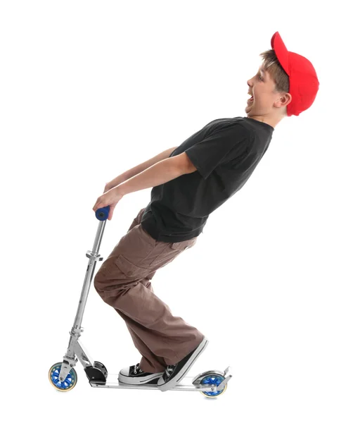 Niño juega en un scooter — Foto de Stock