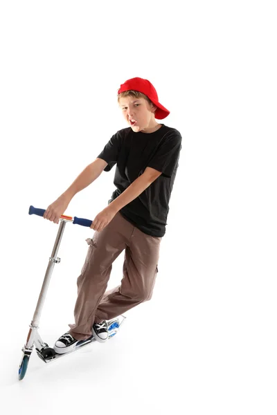 滑板车男孩显示一些的态度 — 图库照片