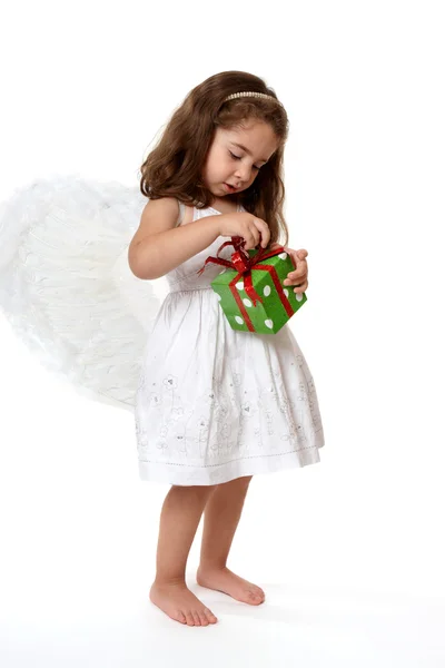 Criança anjo com presente de Natal — Fotografia de Stock