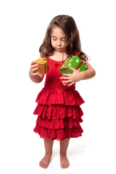 Kucak dolusu hediyeleri ile küçük kız — Stok fotoğraf