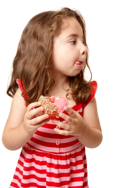 Pequena menina saborosa doce donut — Fotografia de Stock