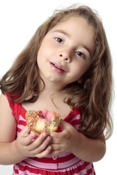 Smiling girl eating snack pink donut — Stock Photo, Image