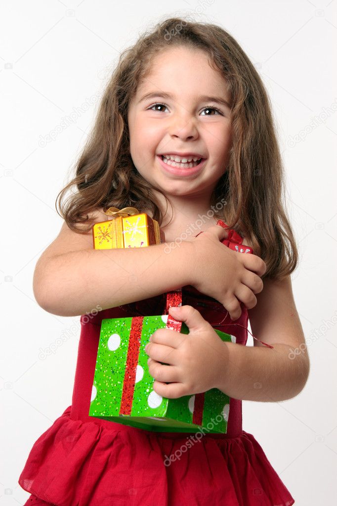 Happy girl child holding presents