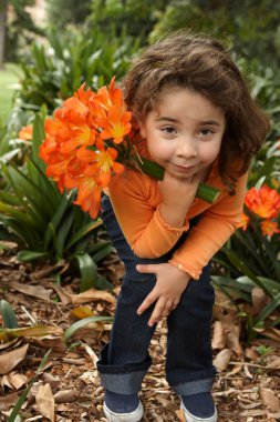 Young girl with a bunch of lilies clipart