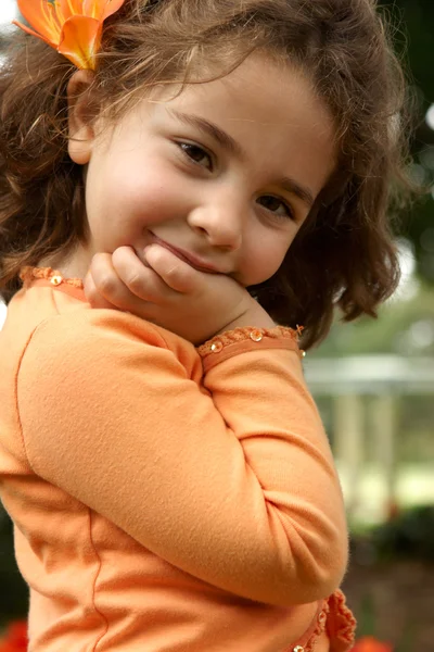 Pretty little girl smiling outdoors Stock Photo