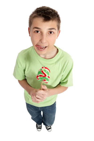 Boy with lollipop licking lips — Stock Photo, Image