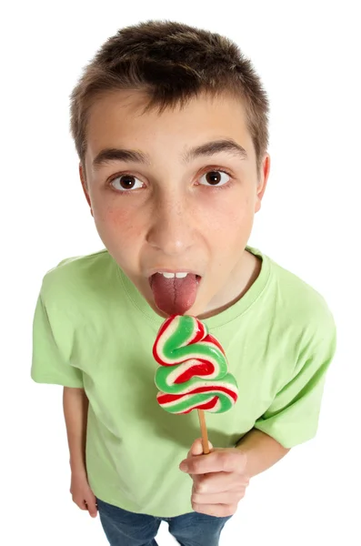 Boy licking lollipop — Stock Photo, Image