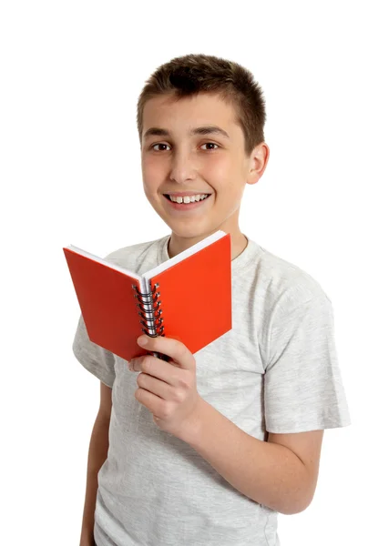 Estudante da escola sorrindo segurando pequeno livro — Fotografia de Stock