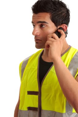 Tradesman handyman on the phone clipart