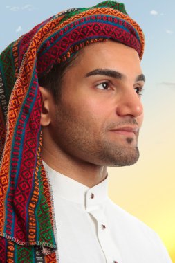 Arab man looks out expectantly clipart