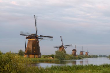 Windmills in evening sun clipart