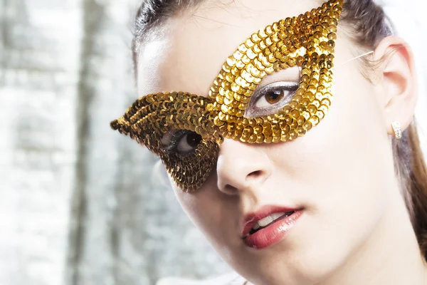 stock image Cute young woman wearing golden mask