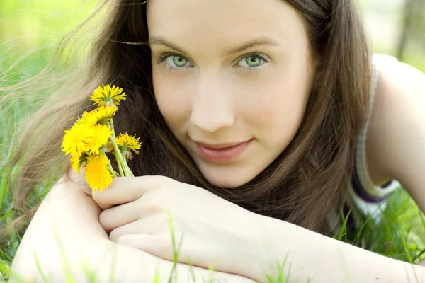 Young beautiful teenager with dandelion — Stock Photo, Image