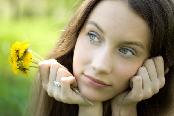 Young beautiful teenager with dandelion — Stock Photo, Image