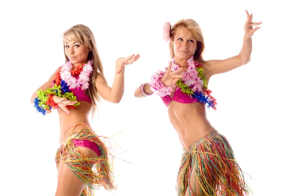 Two pretty dancers in hawaiian costumes isolated Royalty Free Stock Images