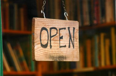 Retail image of open book shop sign clipart