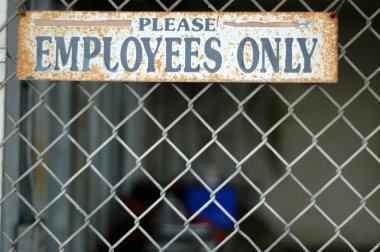 Employees Only Sign at Abandoned Warehouse clipart