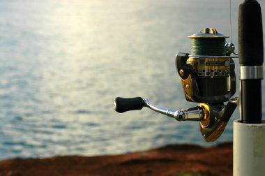 Sports Image Of A Fishing Rod and Reel clipart