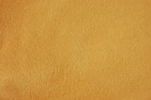 Фоновая текстура мокрого песка — стоковое фото