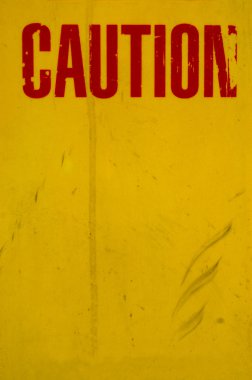 A Grungy Yellow Caution Sign clipart