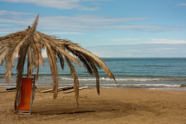 Big umbella and a deckchair