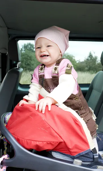 Girl in car seat — Stock Photo, Image