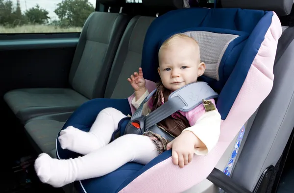 Girl in car seat — Stock Photo, Image