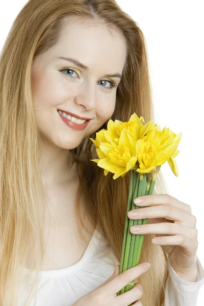 Woman with daffodils — Stock Photo, Image