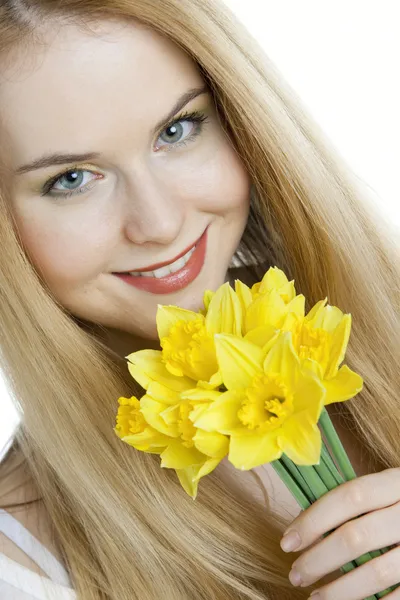 Woman with daffodils — Stock Photo, Image