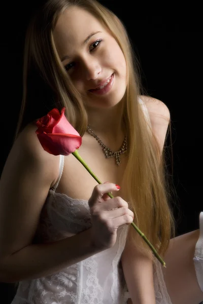 Kvinne med en rose – stockfoto