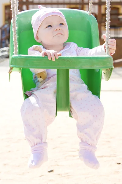 Baby in swing — Stock Photo, Image