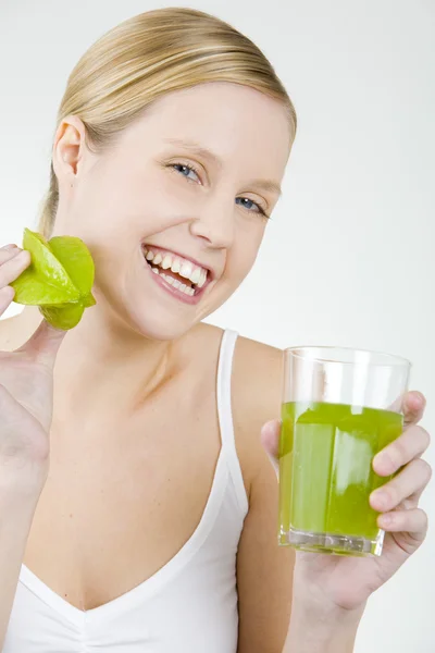 Woman with a glass of juice — Stock Photo, Image