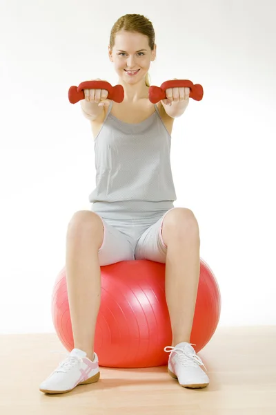 Exercising woman Stock Photo