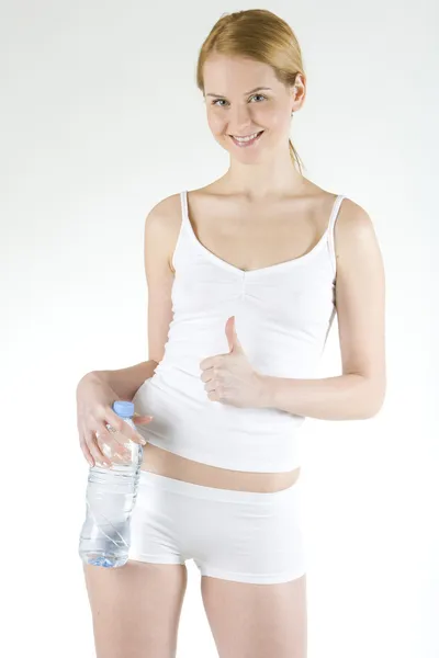 Kvinna med en flaska vatten — Stockfoto