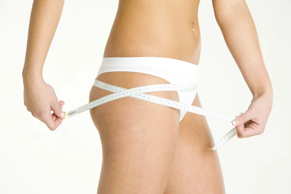 Woman wearing underwear with tape measure — Stock Photo, Image