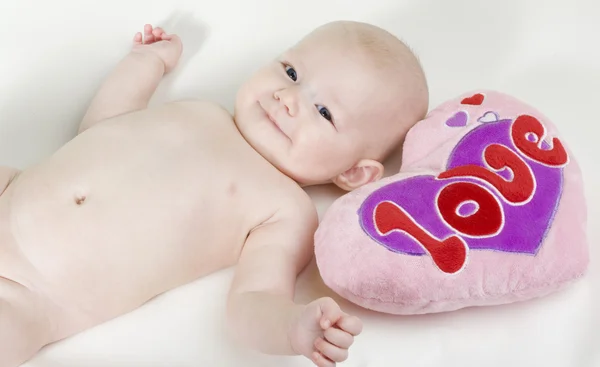 Naked baby with a heart — Stock Photo, Image