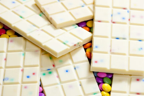 Still life of white chocolate with smarties — Stock Photo, Image