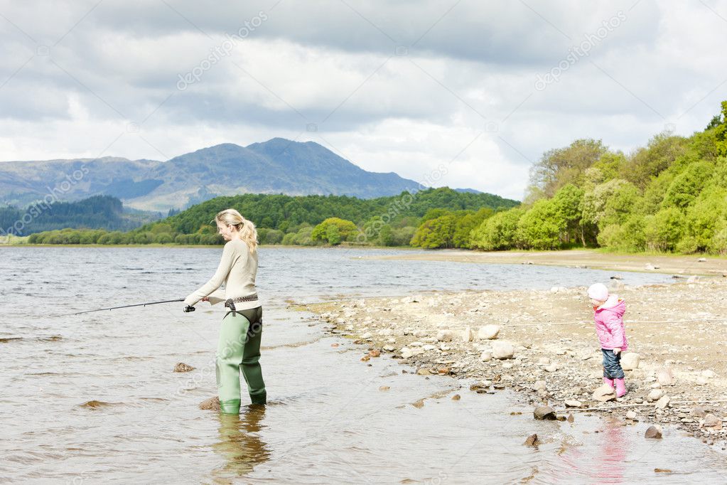 Fishing woman and little girl, Loch Venachar, Trossachs, Scotlan