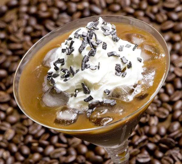 Glass of ice coffee with whipped cream — Stock Photo, Image