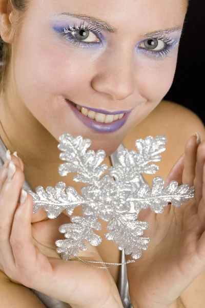 Portrait of woman with snowflake — Stock Photo, Image
