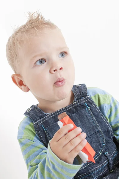 Boy eating chocolate — Stock Photo, Image