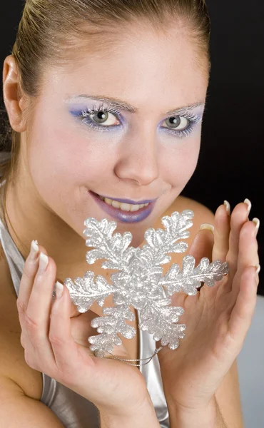 Woman with snowflake — Stock Photo, Image