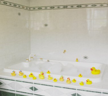 Bath tub with rubber ducks clipart