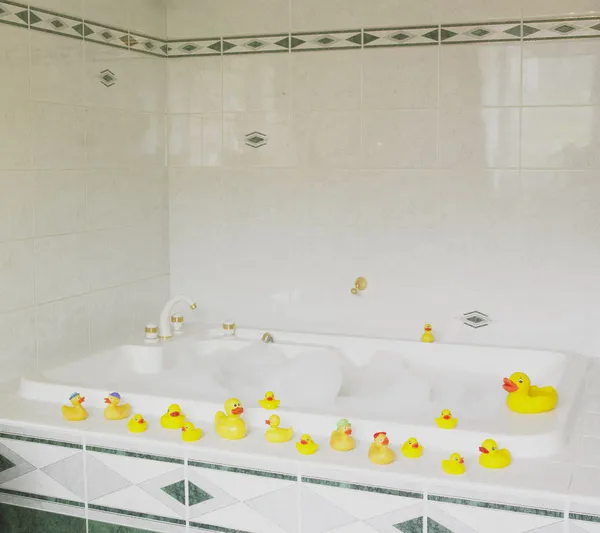 Bath tub with rubber ducks — Stock Photo, Image