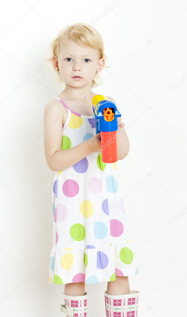 Little girl with bubbles maker