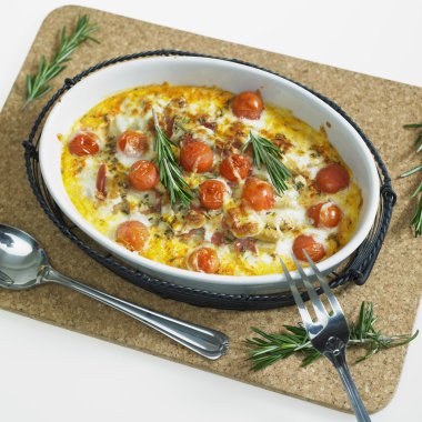 Baked white asparagus with cherry tomatoes on rosemary clipart
