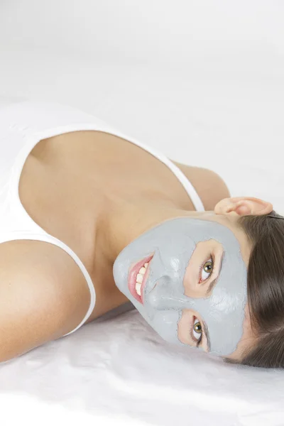 Portrait of woman with facial mask — Stock Photo, Image